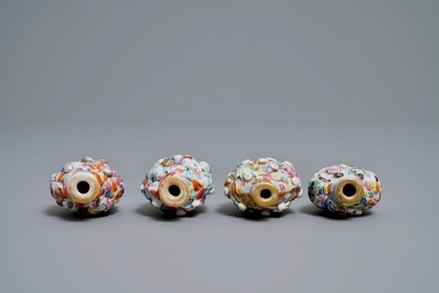 Four Chinese famille rose porcelain relief-decorated snuff bottles, 19th C.